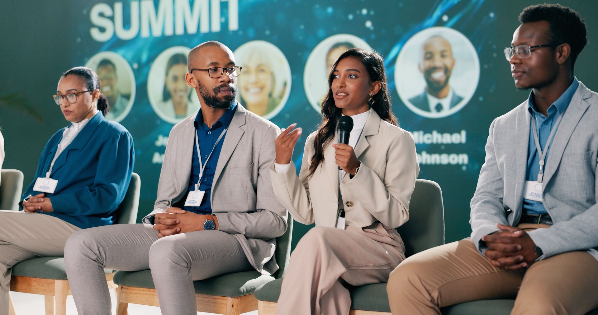 Seminar, presentation and group of business people on stage for coaching expert, event and convention in auditorium. Leadership, summit and speaker panel for networking workshop, tradeshow or speech